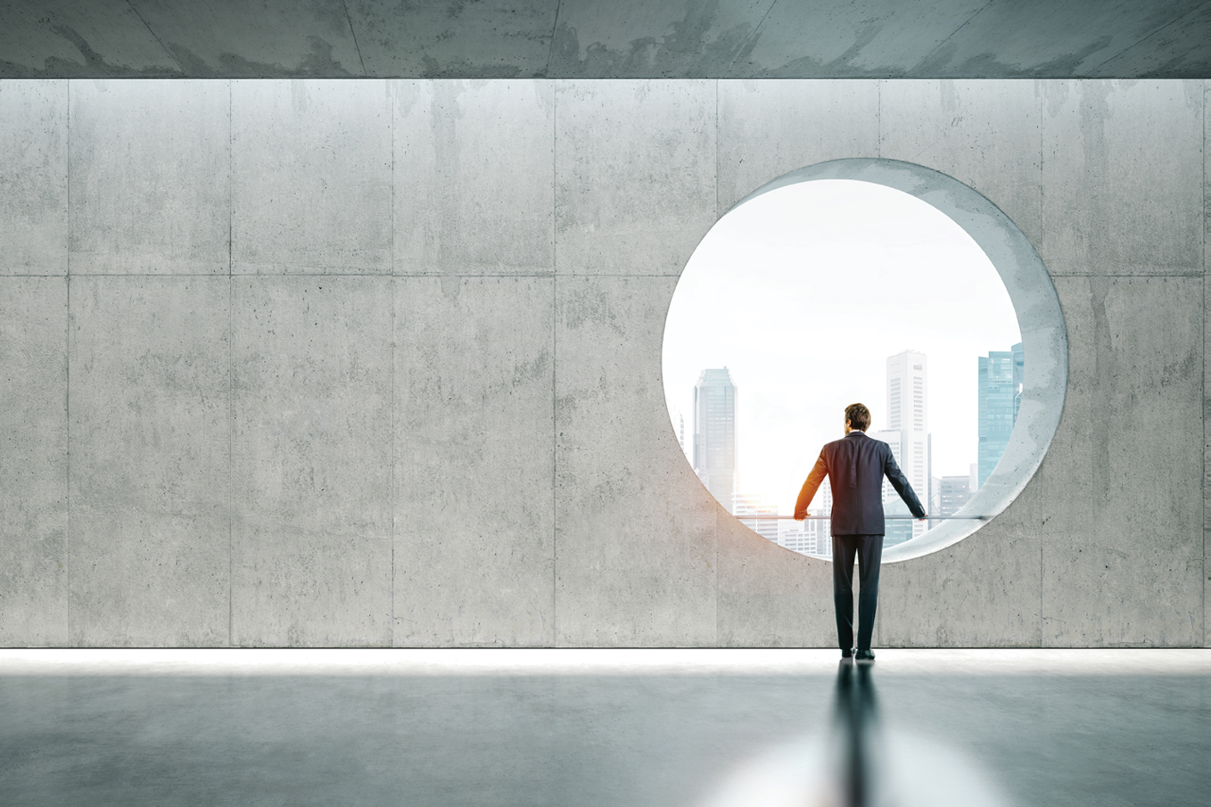 Blank space interior with view on the city and yound bussinesman wearind modern suit